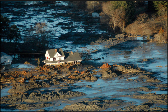 House surrounded by spilled coal ash slurry