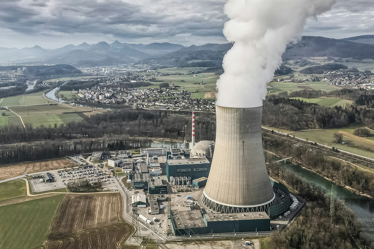 Steam rising from a cooling tower at the Gösgen Nuclear Power Plant