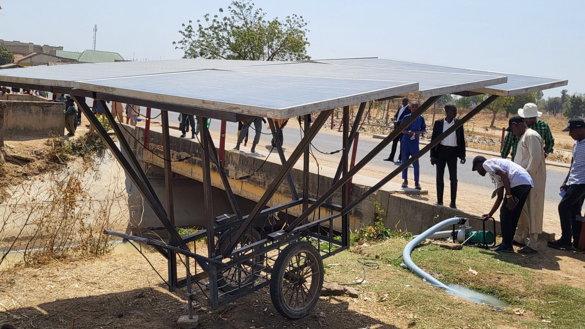 Users operate a solar-powered irrigation pump in Kano, Nigeria.