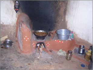 Wood-fired cookstove. Black carbon on the wall is evidence of air pollution.